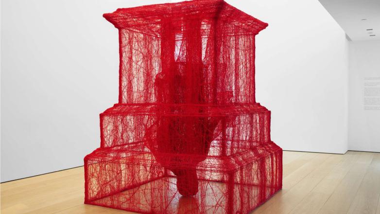 Inverted red mesh monument