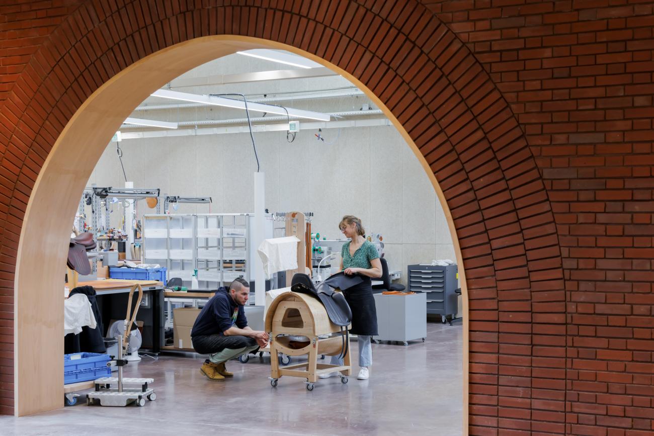 Red brick archway accentuates an interior workshop.