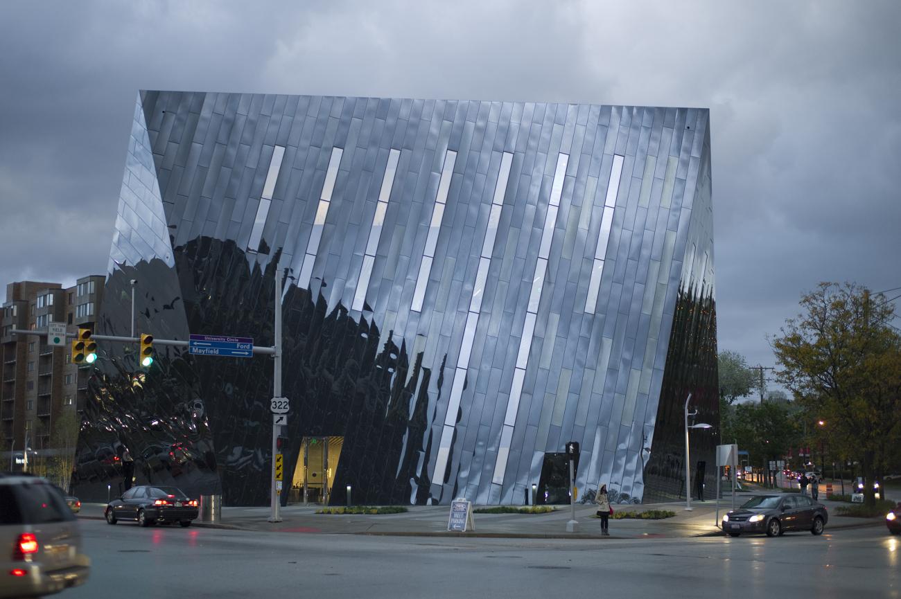 Angular glass building with sloped sides