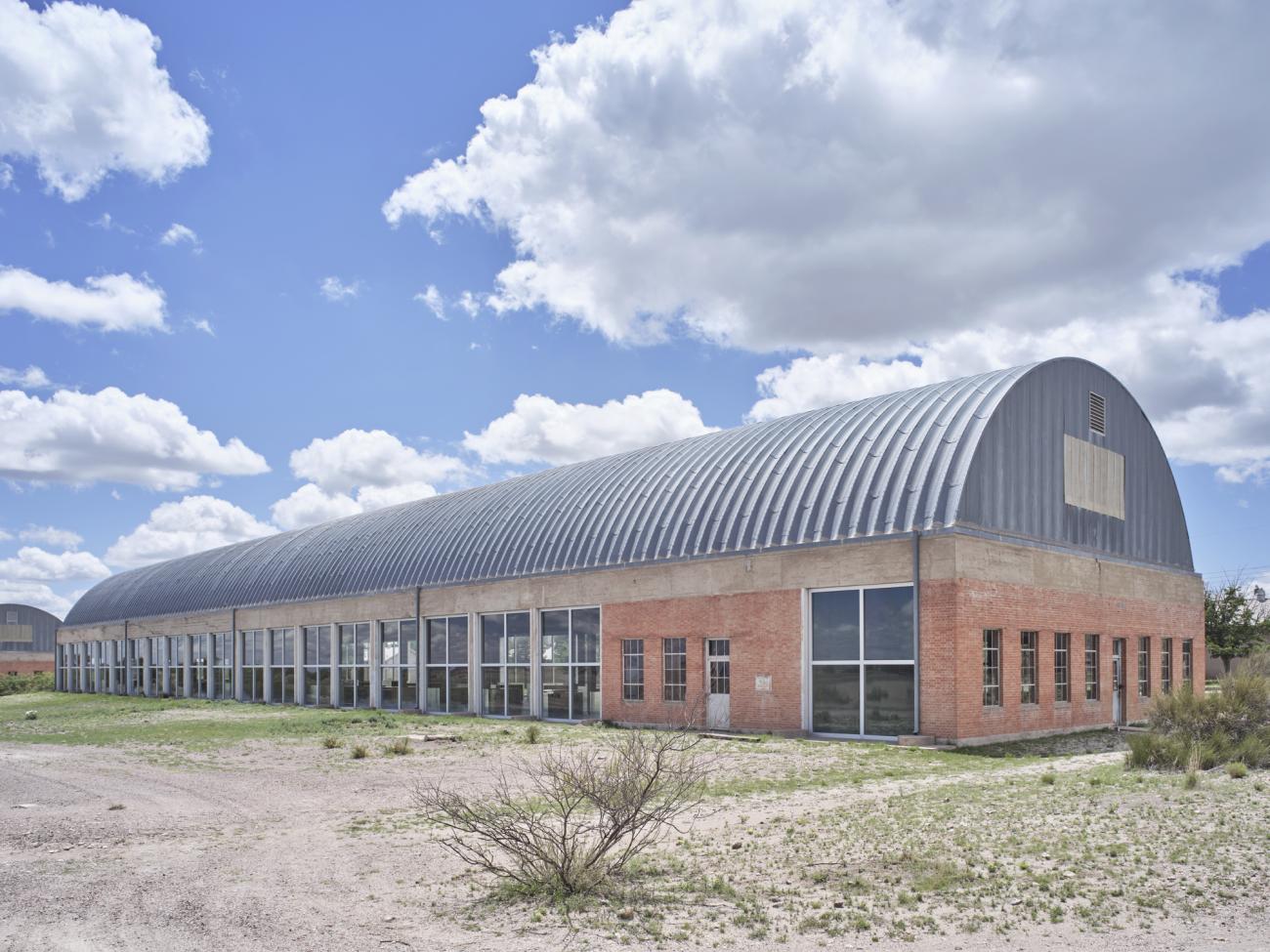 Donald Judd, Artillery shed with 100 untitled works in mill aluminum, 1982–86. Permanent collection, The Chinati Foundation, Marfa, Texas. Photo by Alex Marks, courtesy The Chinati Foundation. Donald Judd Art © 2025 Judd Foundation / Artists Rights Society (ARS), New York