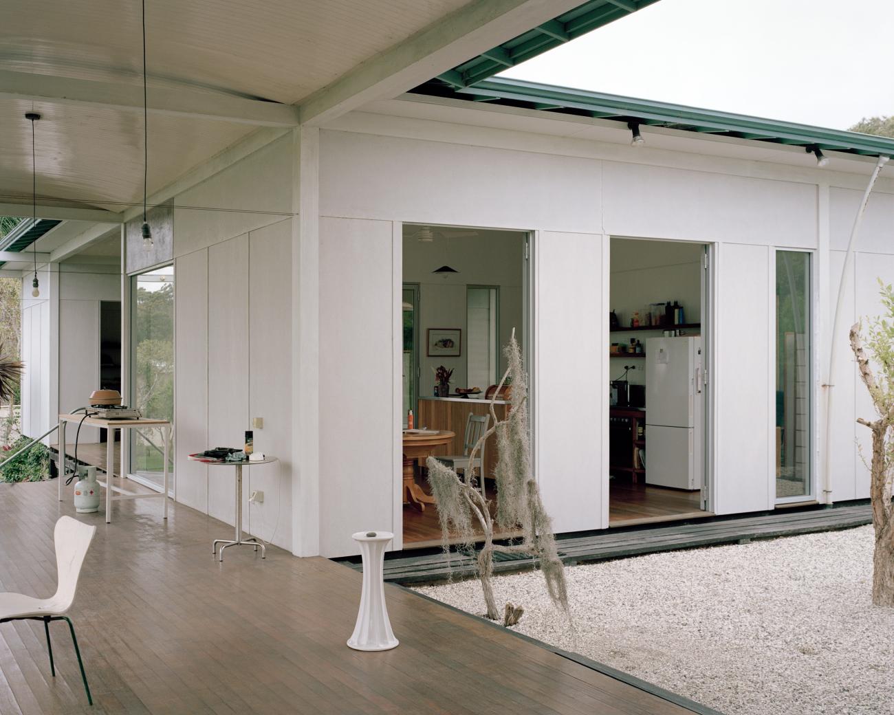 House with a guest room by Andrew Power