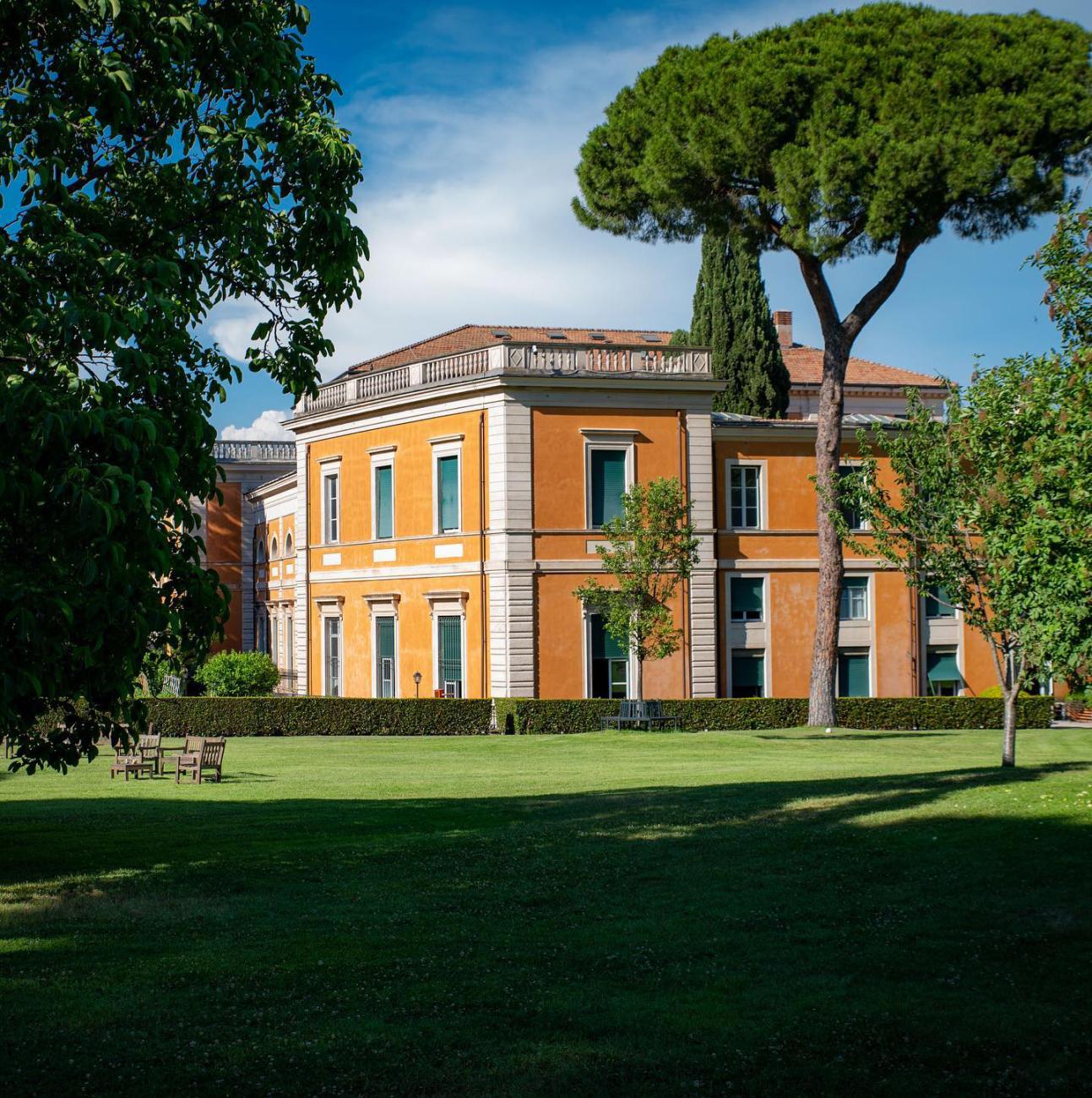 image of two level orange colored home in Rome