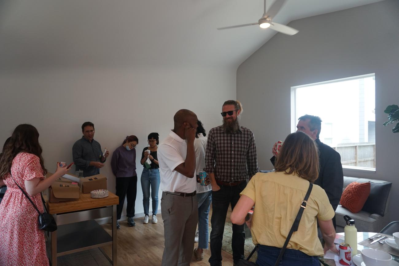 photo of group of people inside accessory dwelling unit