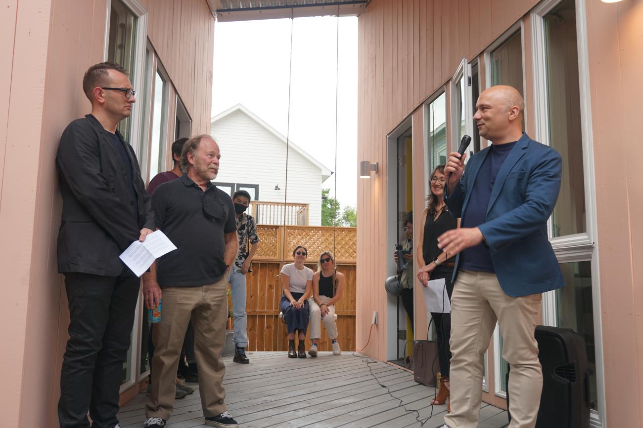 photo of people standing near accessory dwelling unit