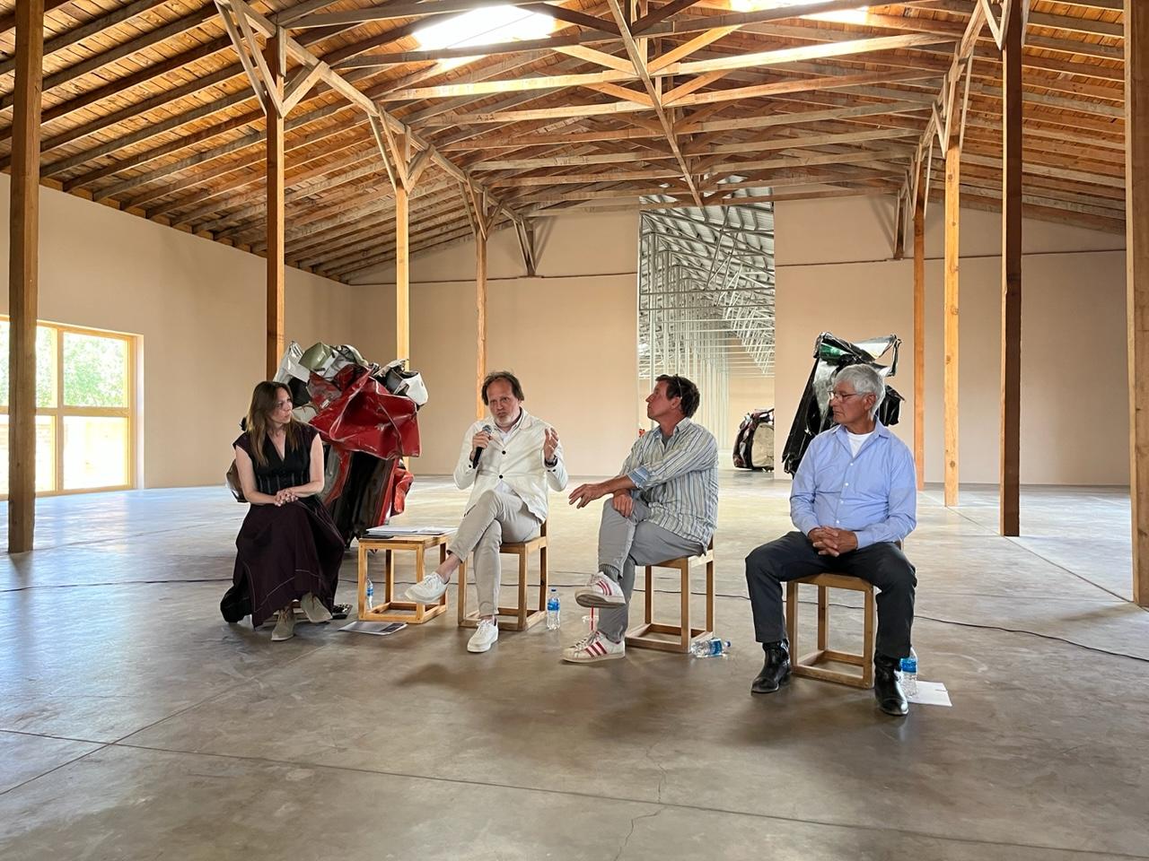 Photo of people sitting in chairs