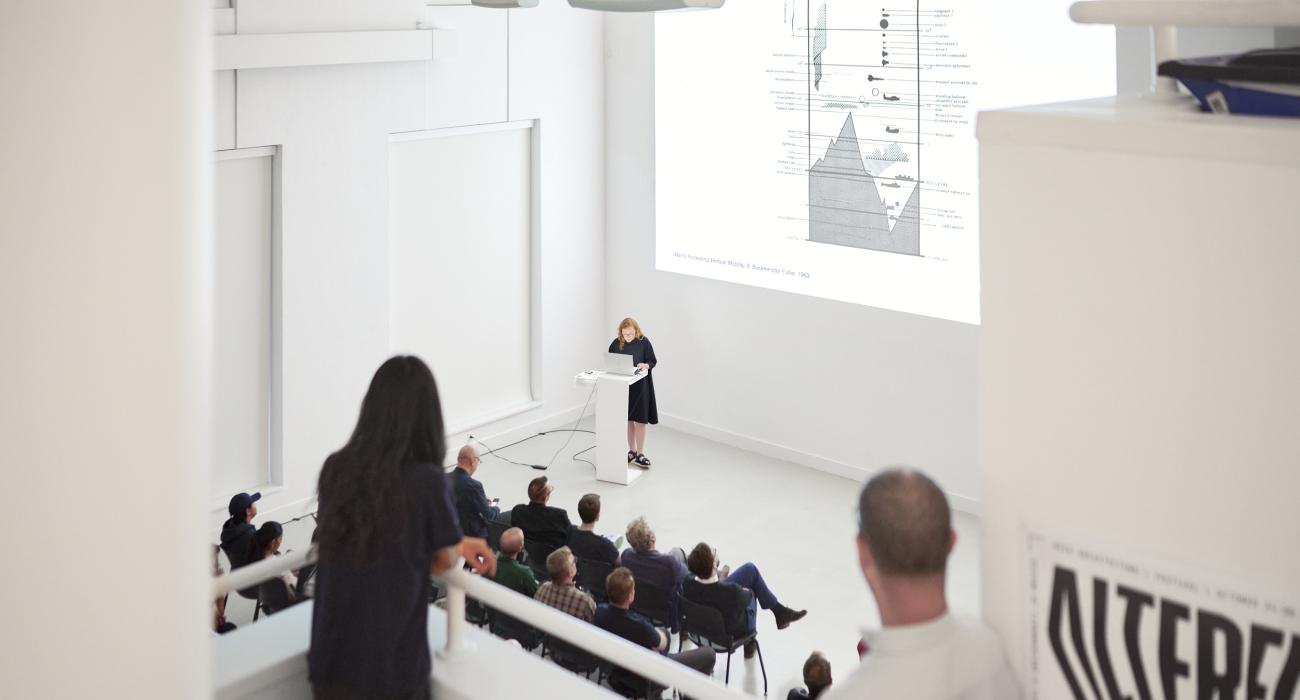 Assistant professor Brittany Utting speaks before the opening of The Sixth Sphere, an exhibition she curated.